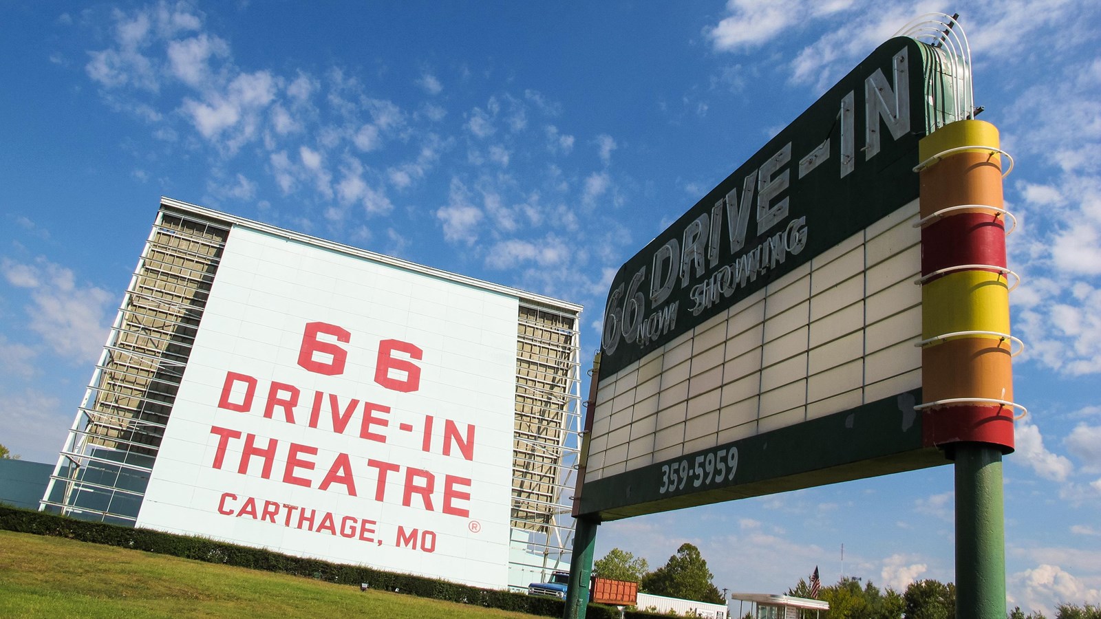 A 66 foot tall white screen reads 