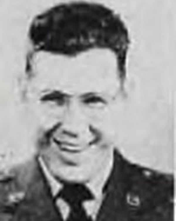 Young man smiling for photo in a united states military dress uniform. 