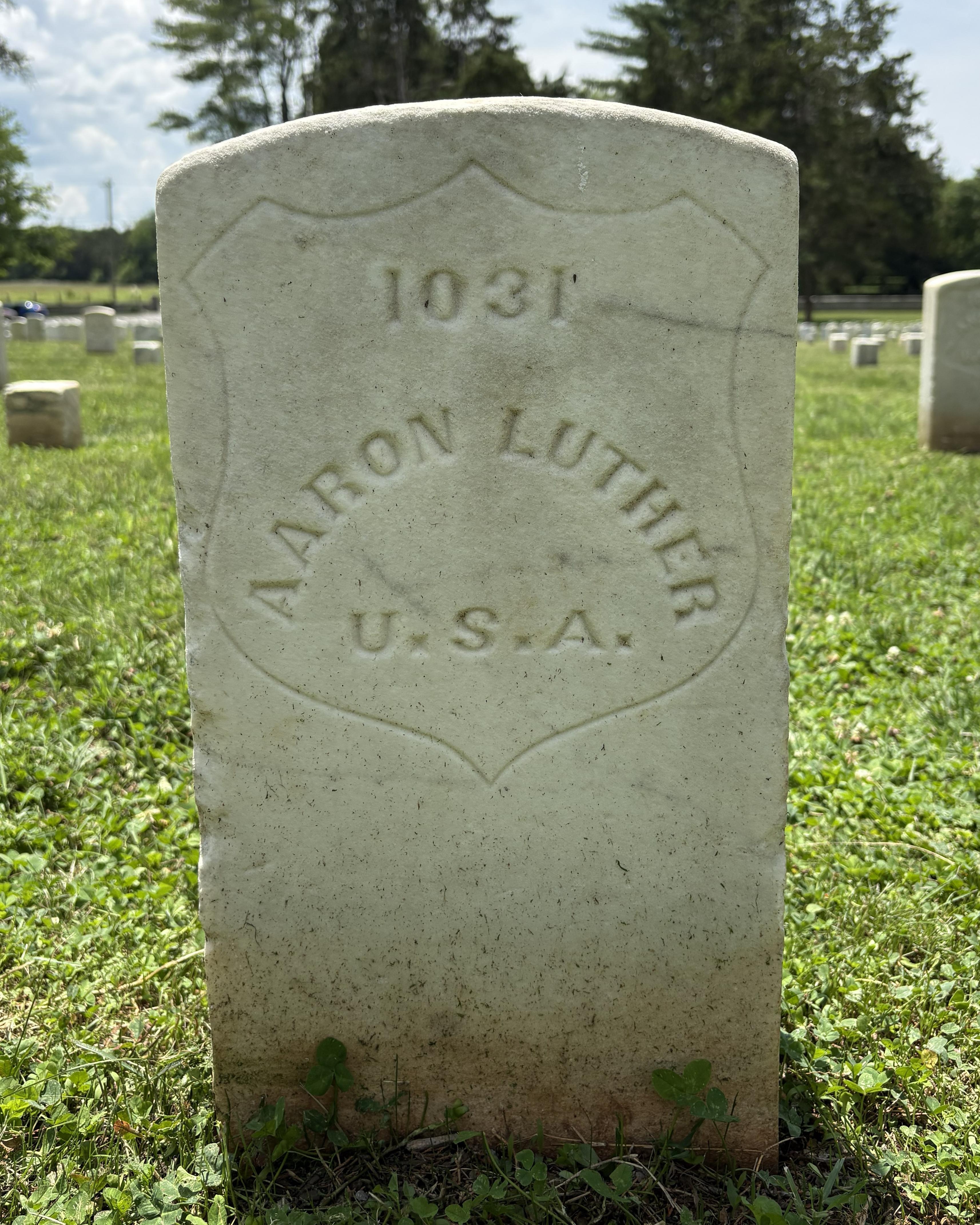 Marble headstone belonging to Civil War veteran Aaron Luther. 