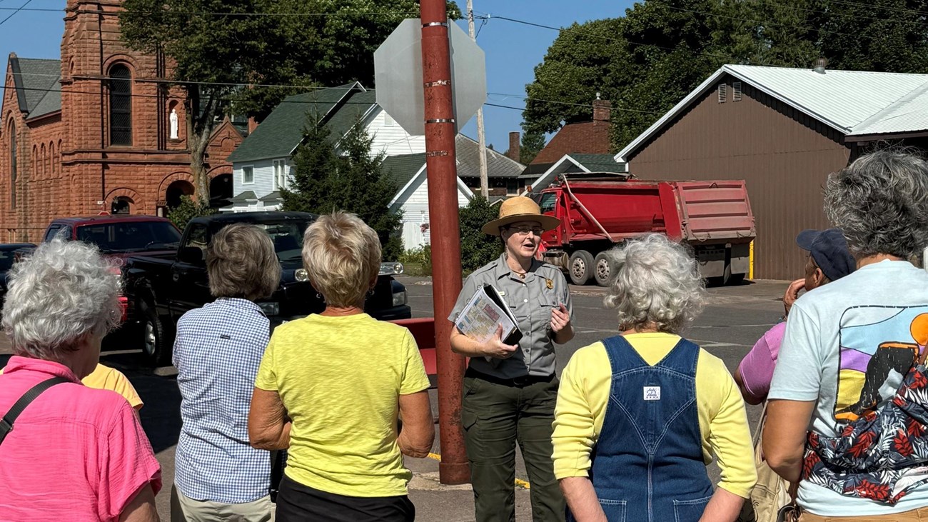 A park ranger discusses local history during a guided tour of Calumet, MI.