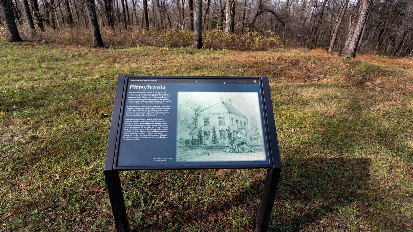 A drawing of a house is displayed on the panel. It depicts a house with a chimney and trees around.
