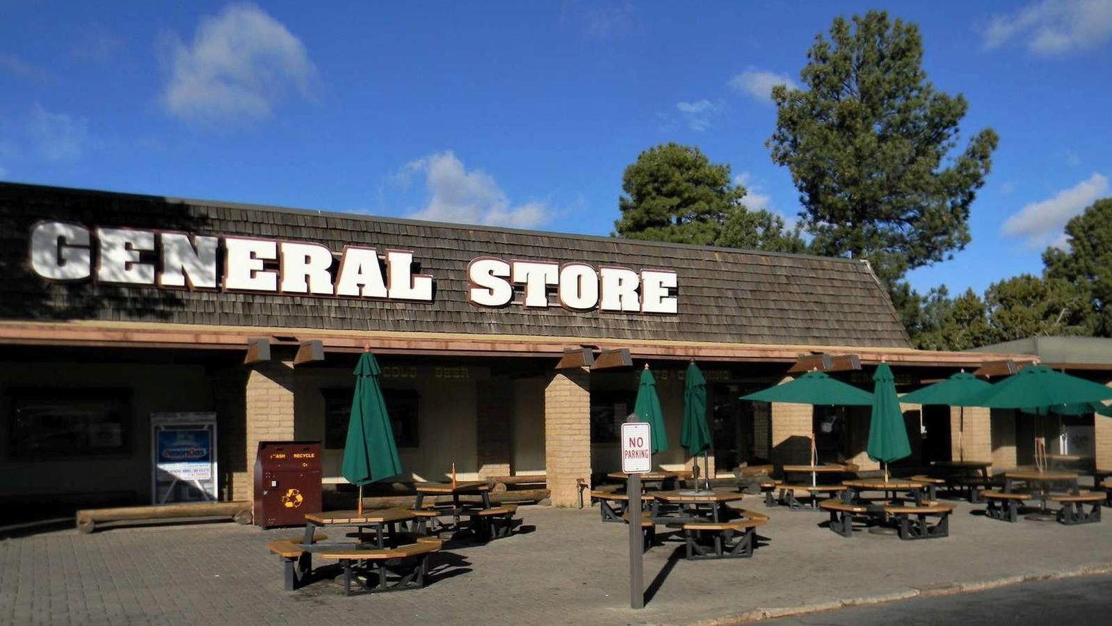 Large white letters reading General Store dominates the roof of a single story brown building