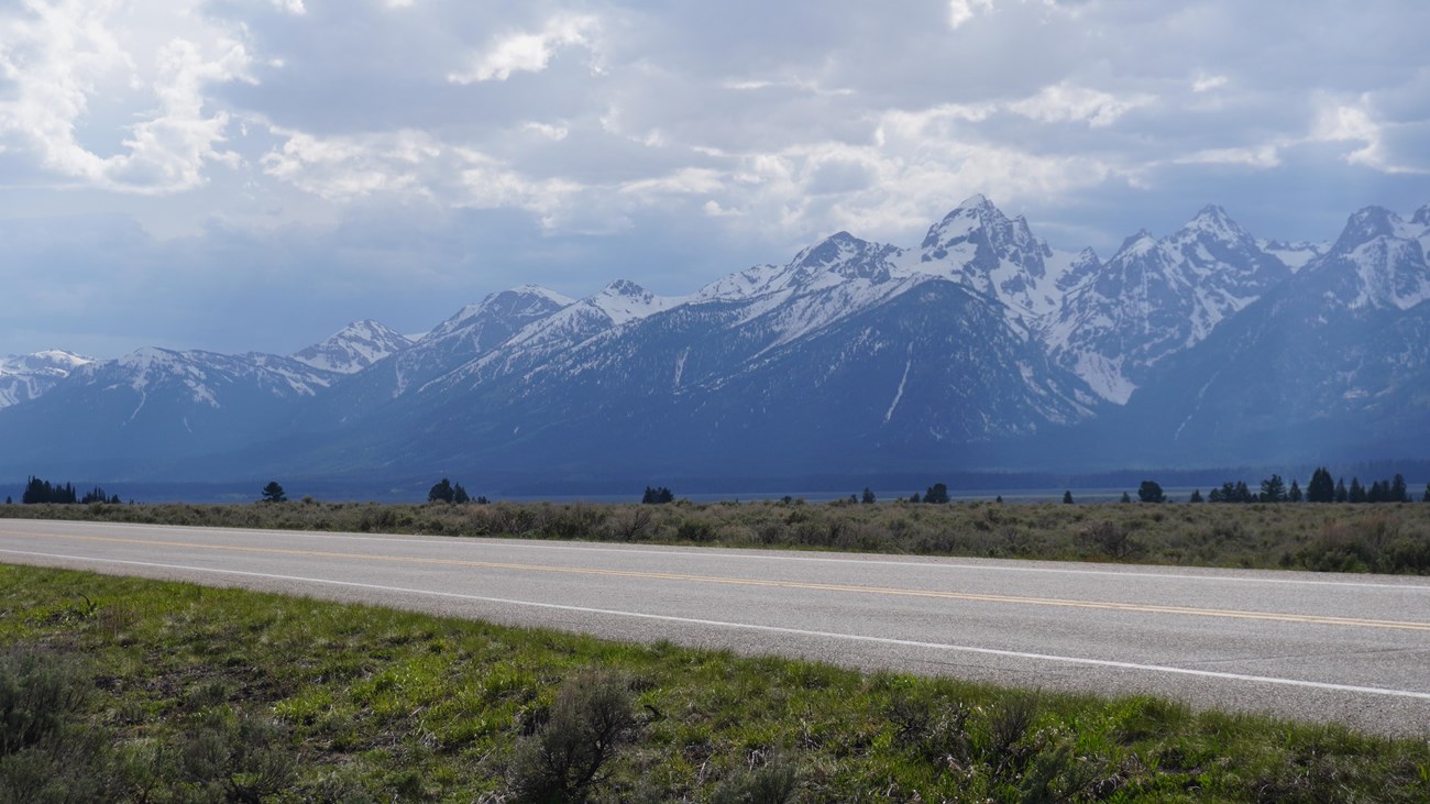 Highway with mountains in background