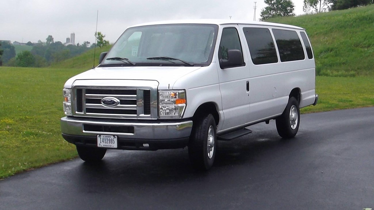 A white 15 passenger van.