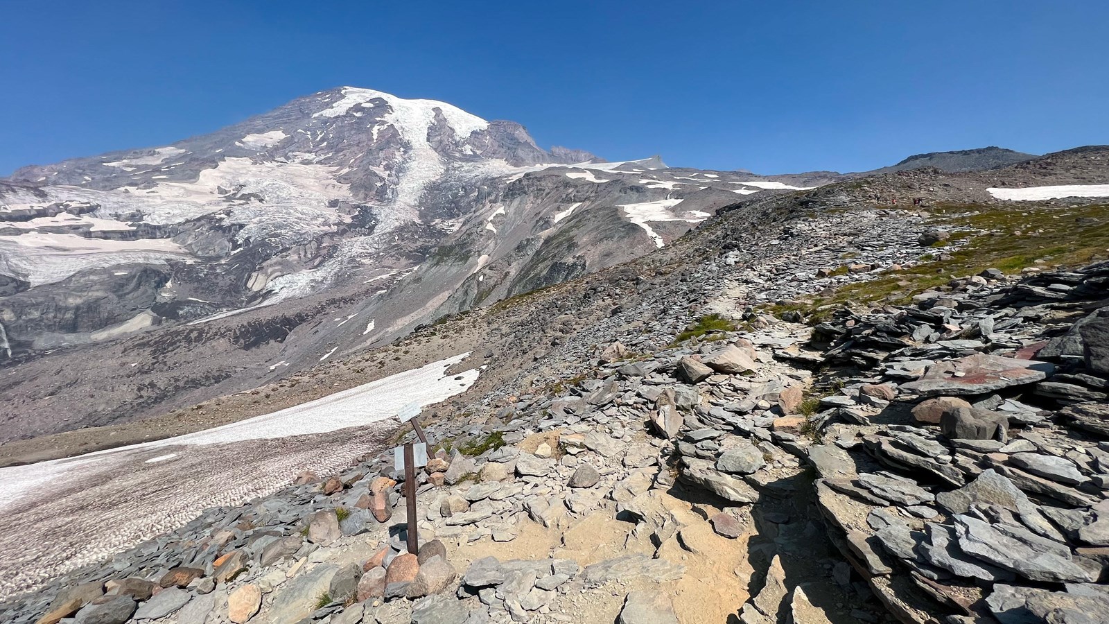 V-shaped intersection surrounded by rocks with glaciated mountain to the north