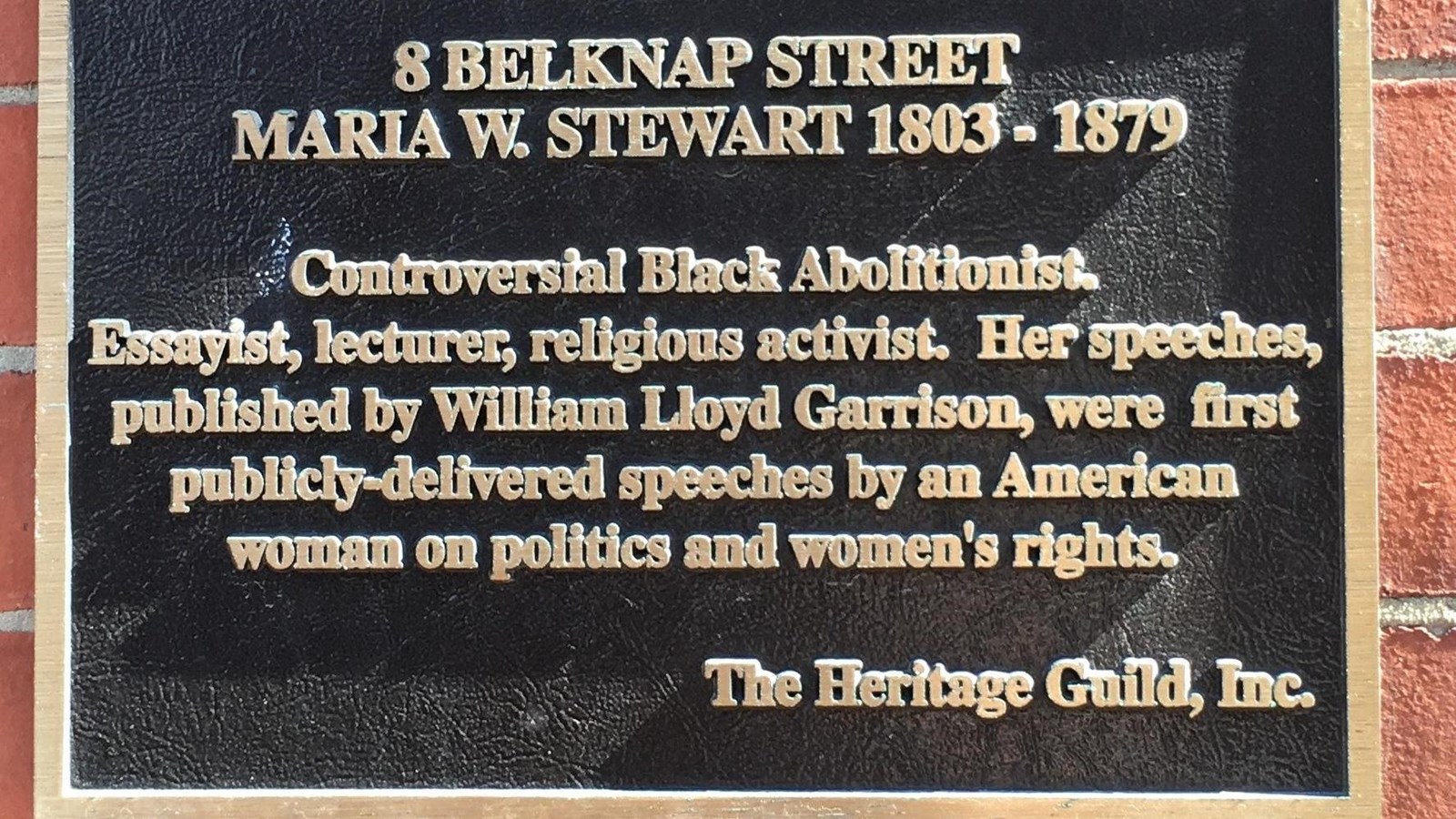 Historical plaque on a brick building identifying the location as the former home of Maria Stewart.