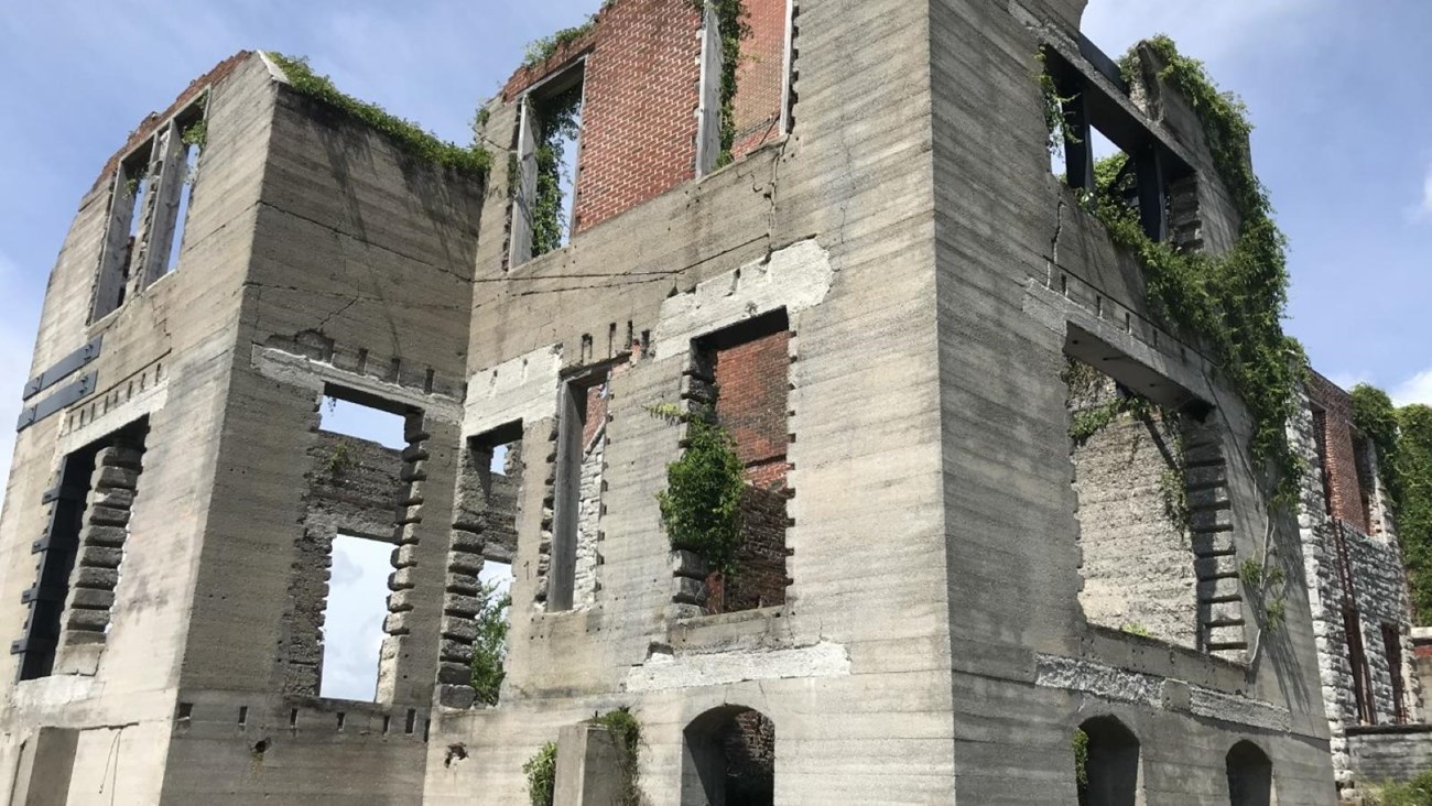 Ruins of several story Dungeness mansion with window openings in tabby and brick.