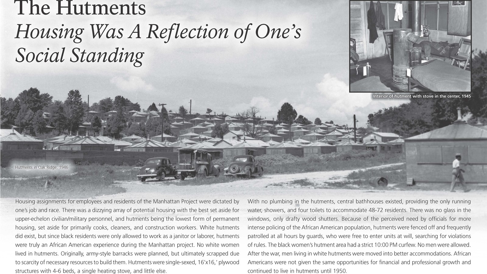 A wayside exhibit with text and an image of hutments, one-room shacks.