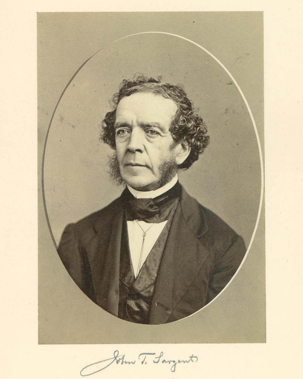 1800s portrait of middle-aged man with dark hair and glasses