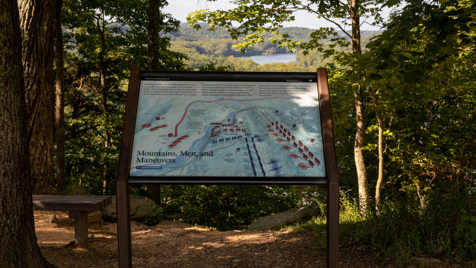 Exhibit panel with maps of troops in battle formation in front of a river.