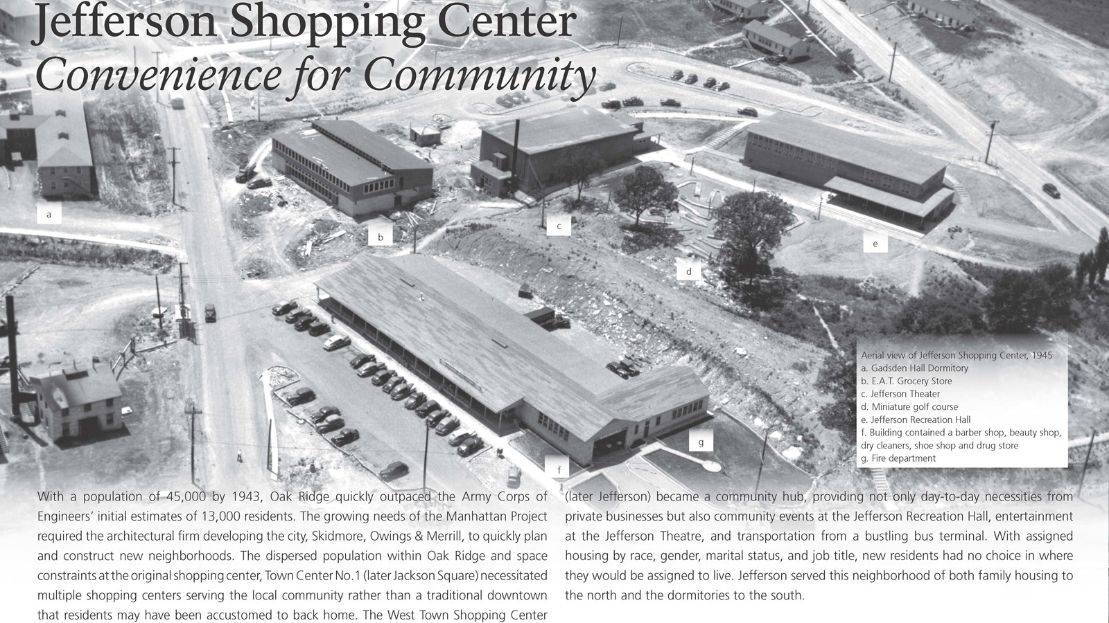 A wayside with text and an image of a large shopping center.