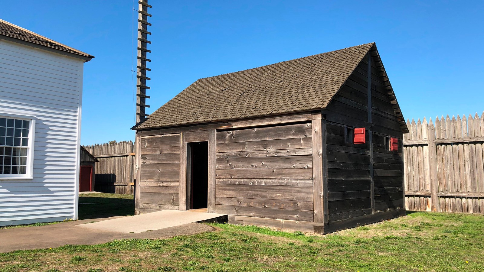 A square wooden building.