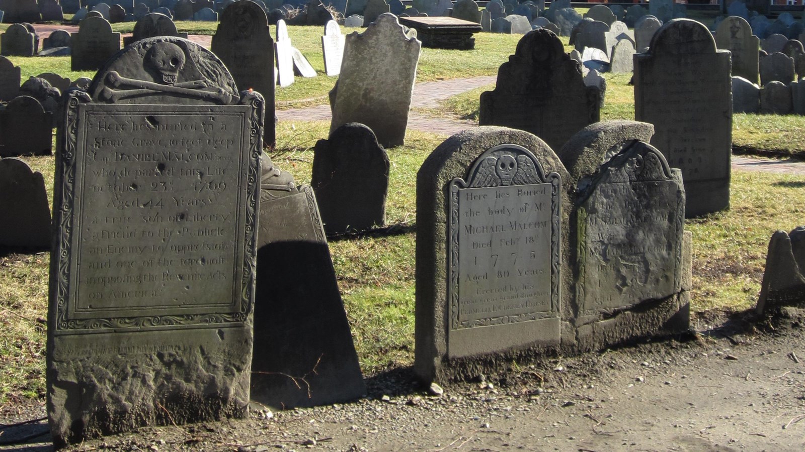 View of many headstones in a green space