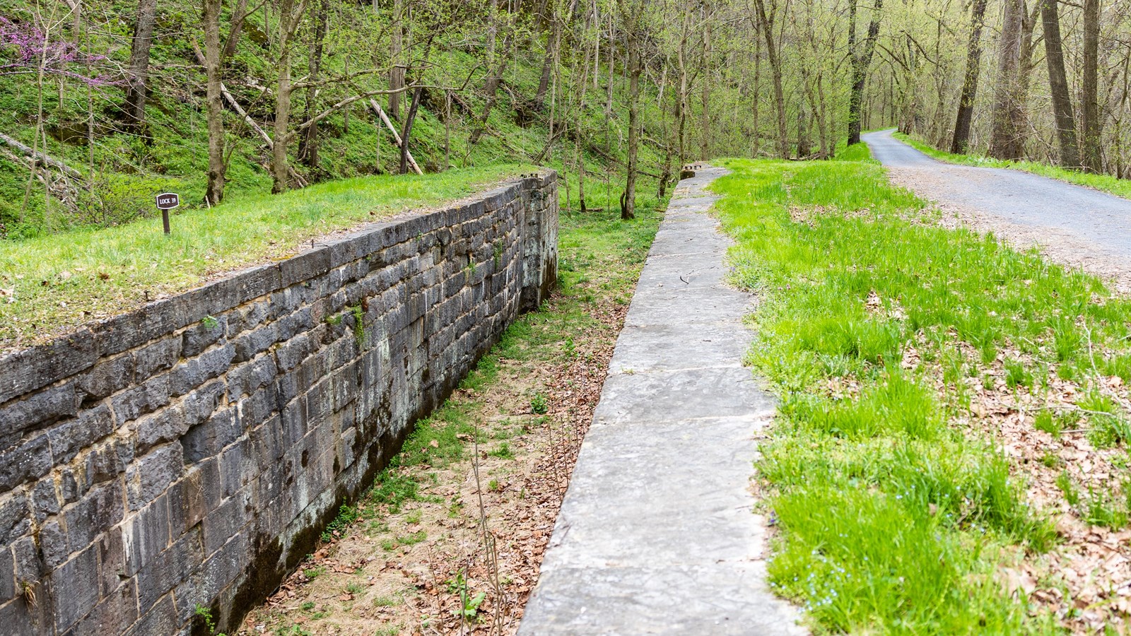 An historic stone lock next to the canal towpath
