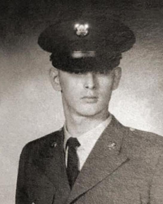 Young man in U.S. Military dress uniform posing for photo. 