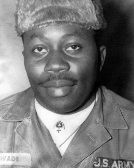 Young man wearing a hat and a US Army field uniform.