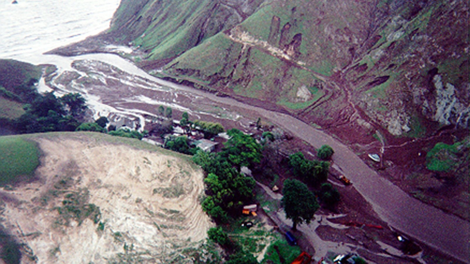 aerial view of flooded valley filled with mud. 