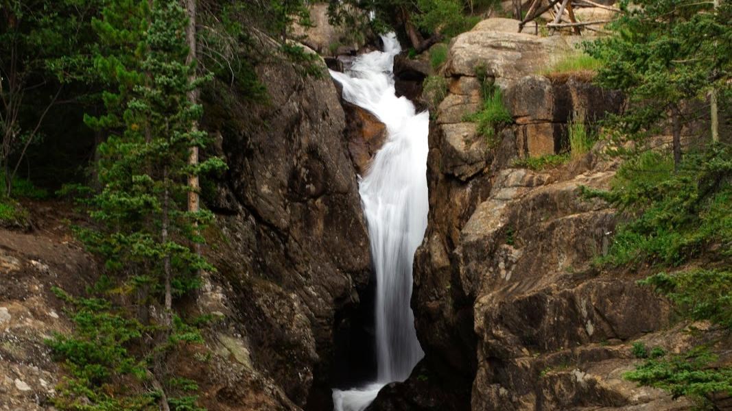 water cascading over a rocky cliff