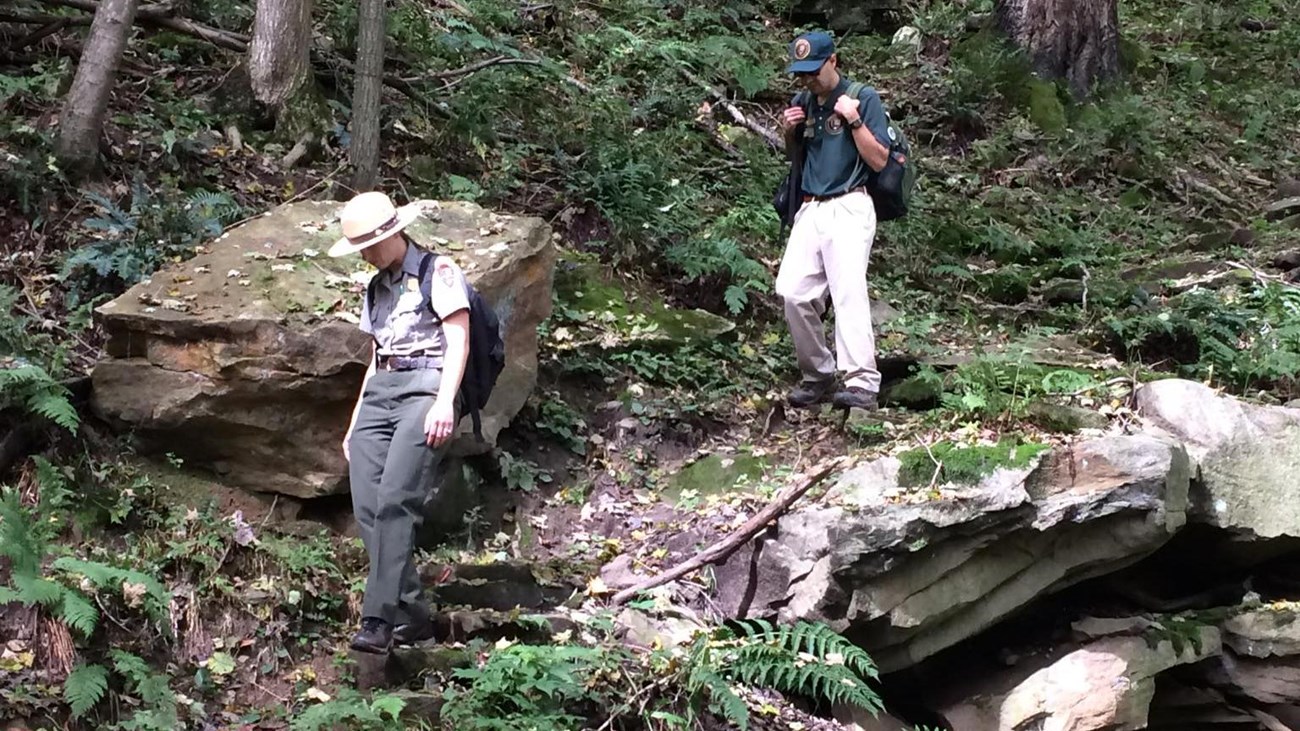 Two people on a rugged section of the trail