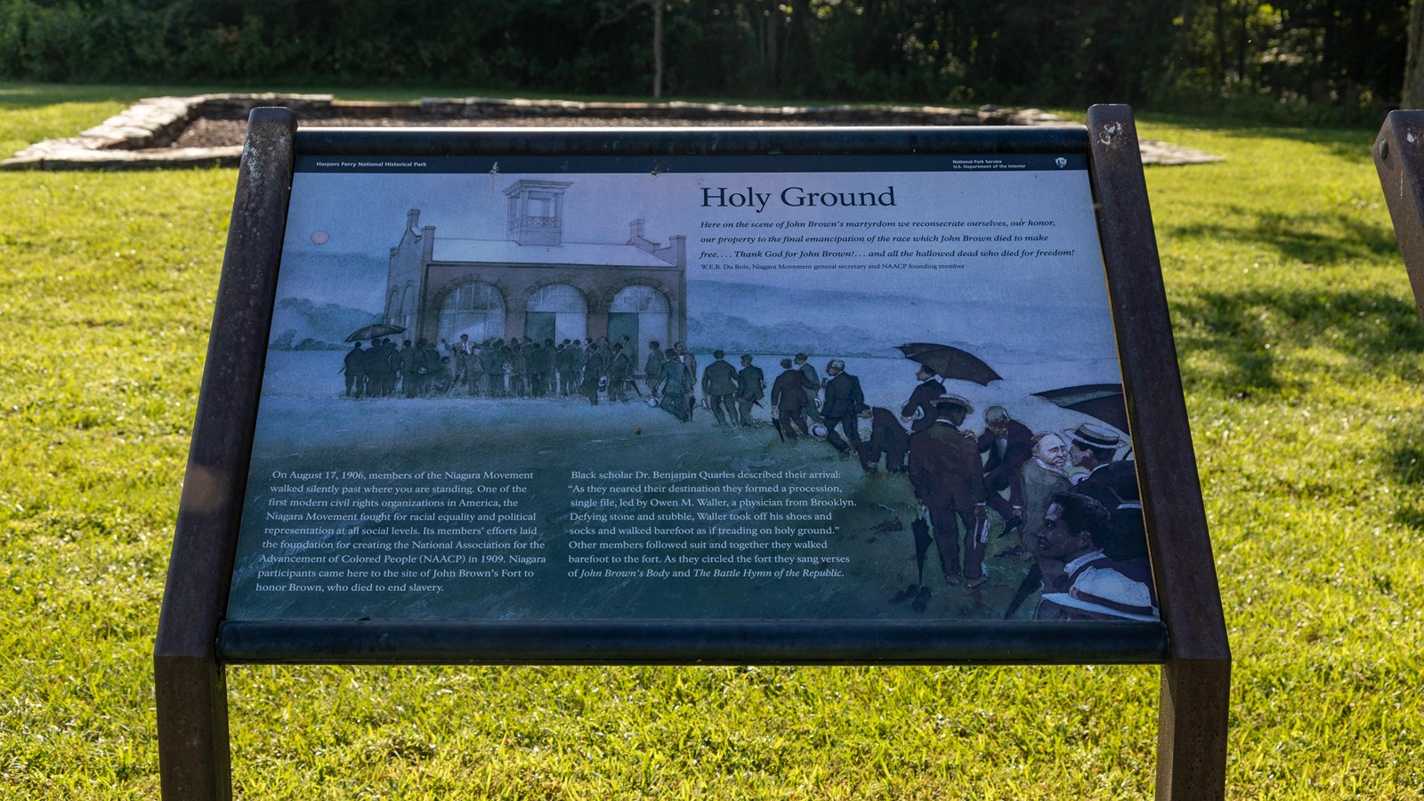 Exhibit panel showing a procession of people approaching a small building.