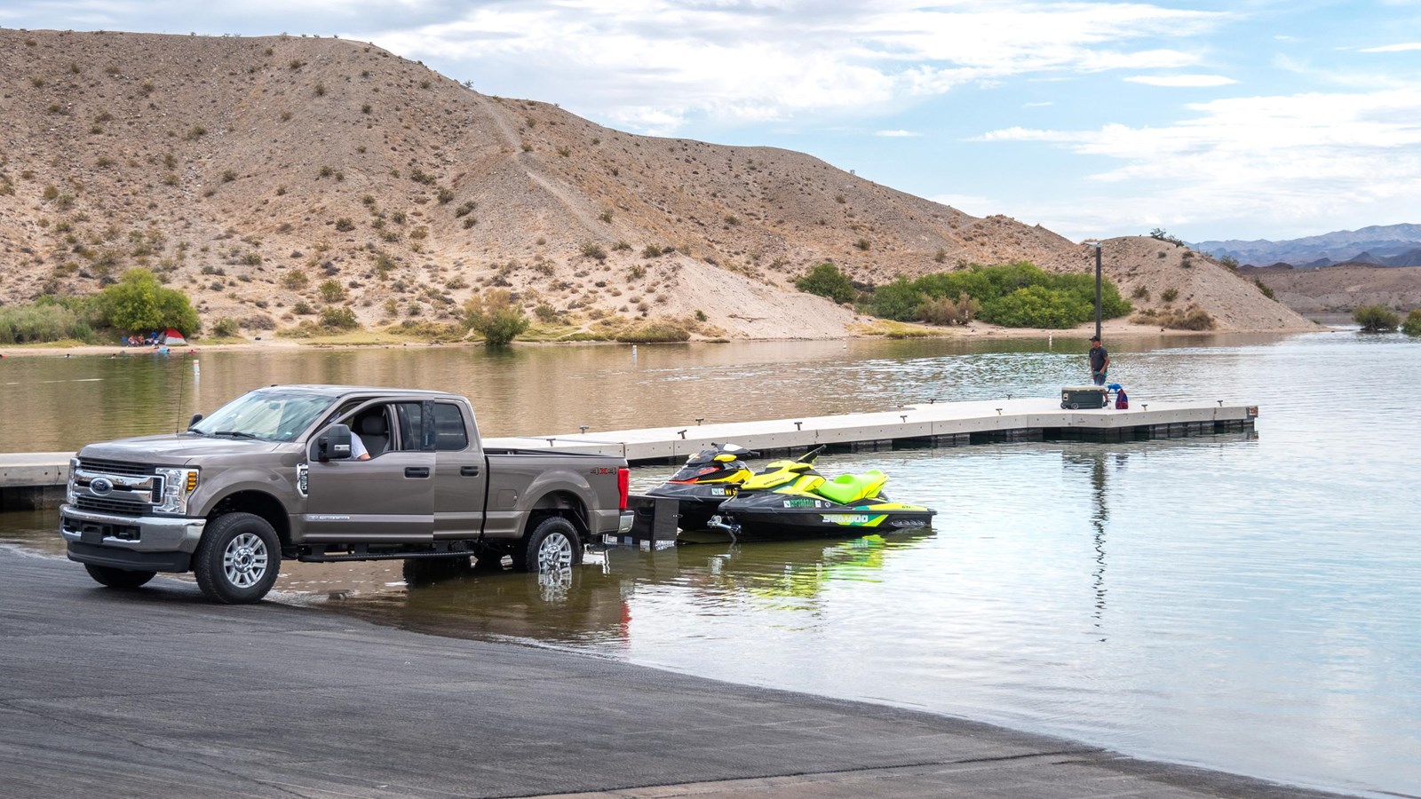A truck launching a boat into a body of water