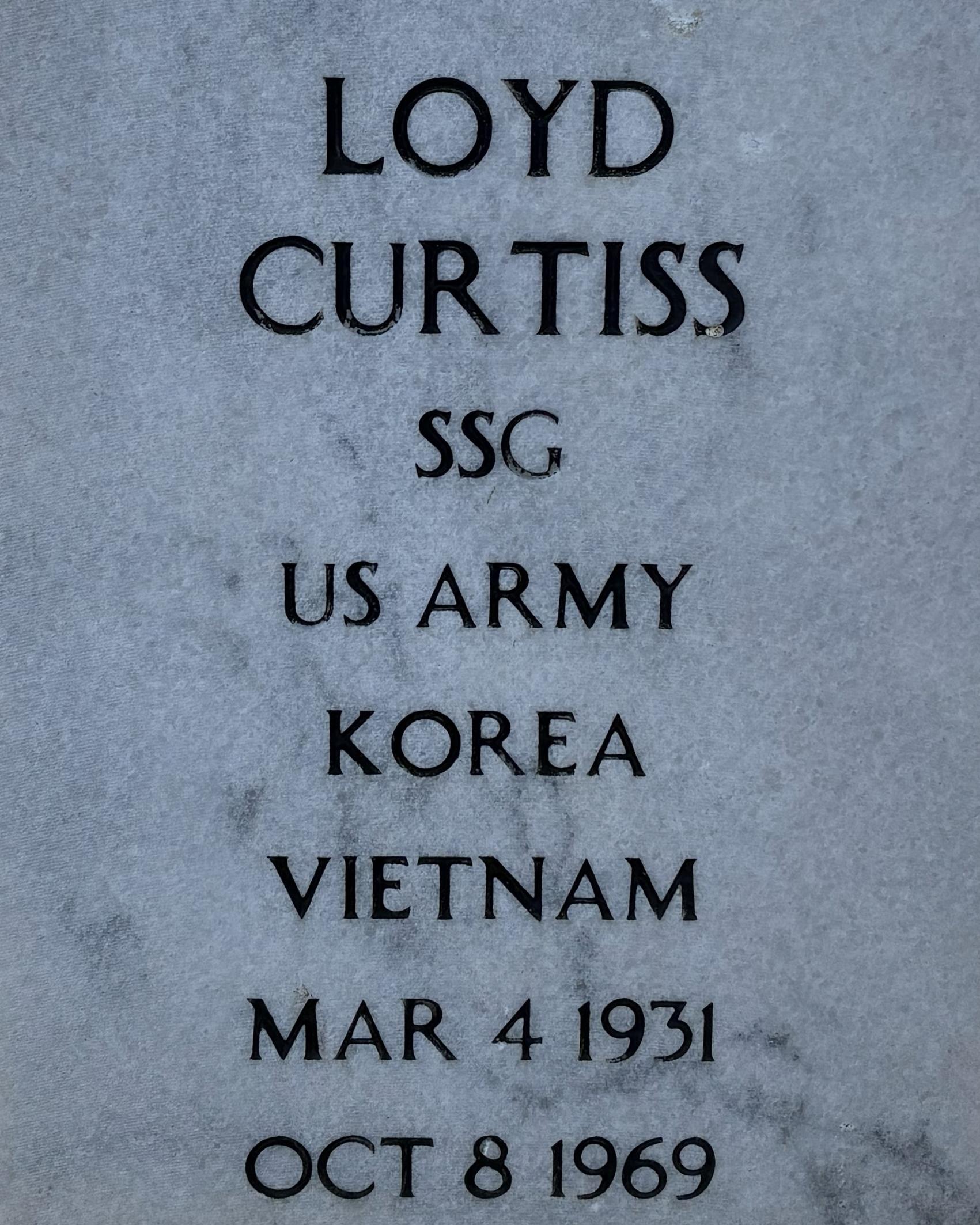 Marble headstone belonging to Loyd Curtiss located at the Stones River National Cemetery.