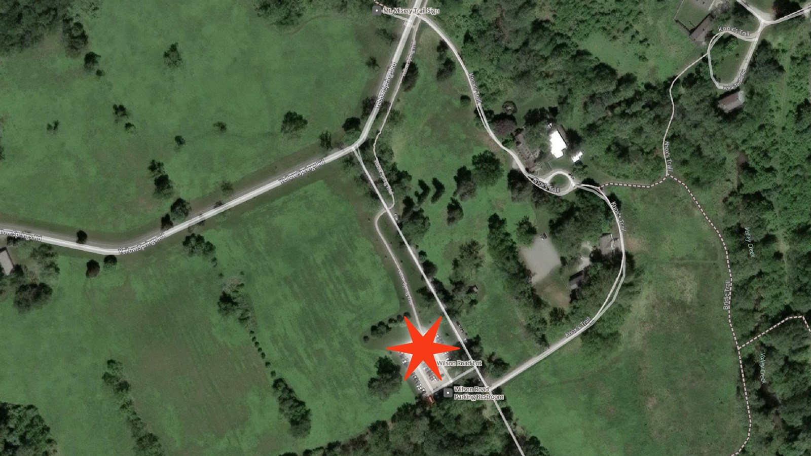 Aerial photo of Wilson Rd area with star in the parking lot marking pick up drop off location