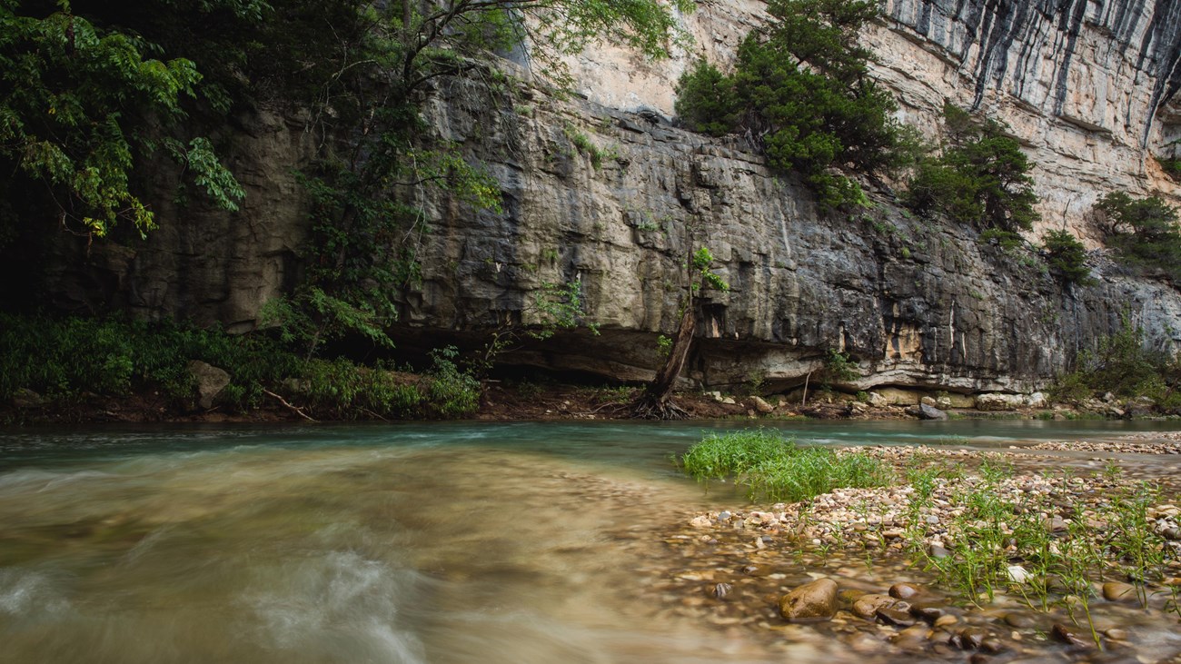 Water rushing along the base of Roark Bluff