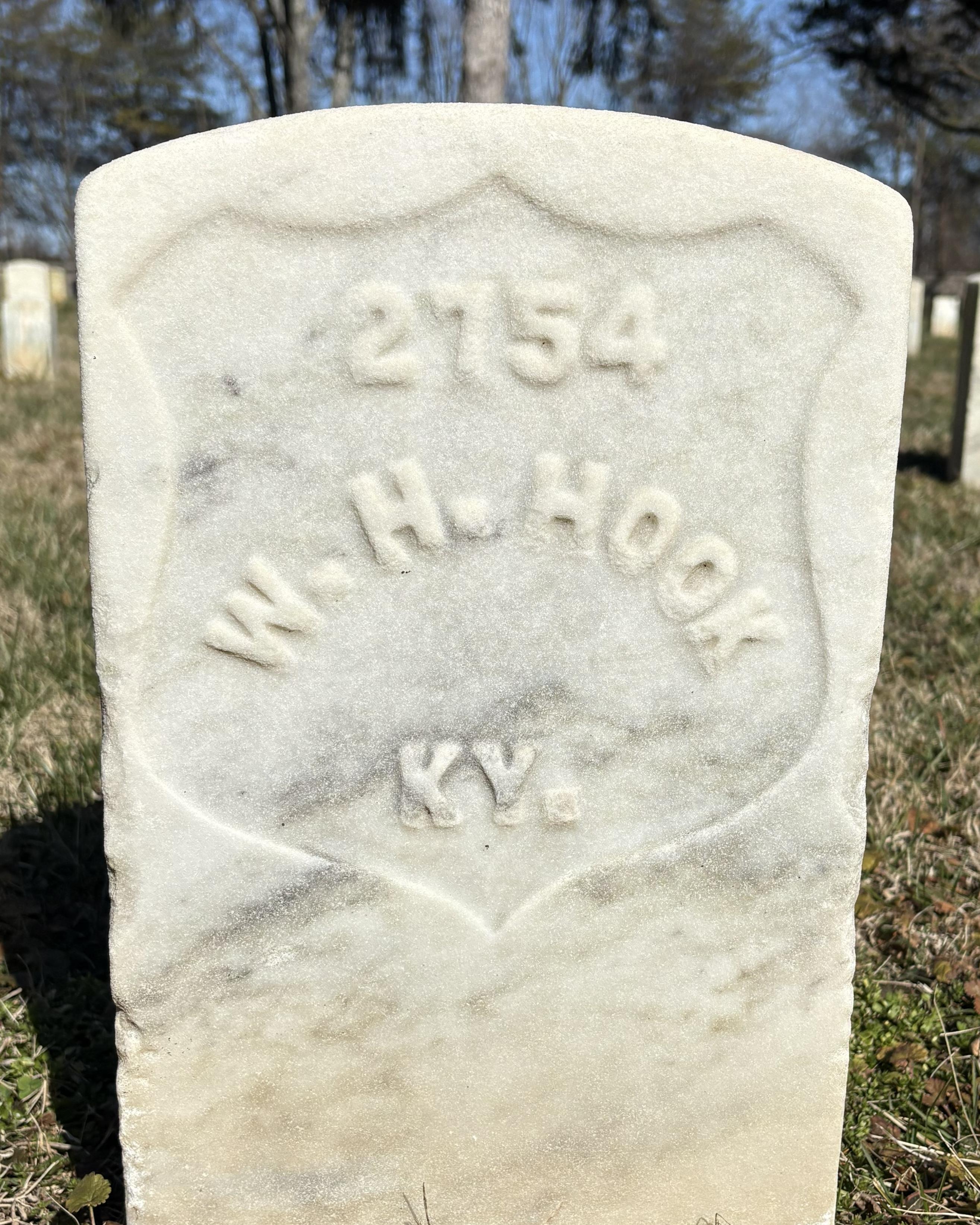 Marble headstone reading "W.H. Hook" 