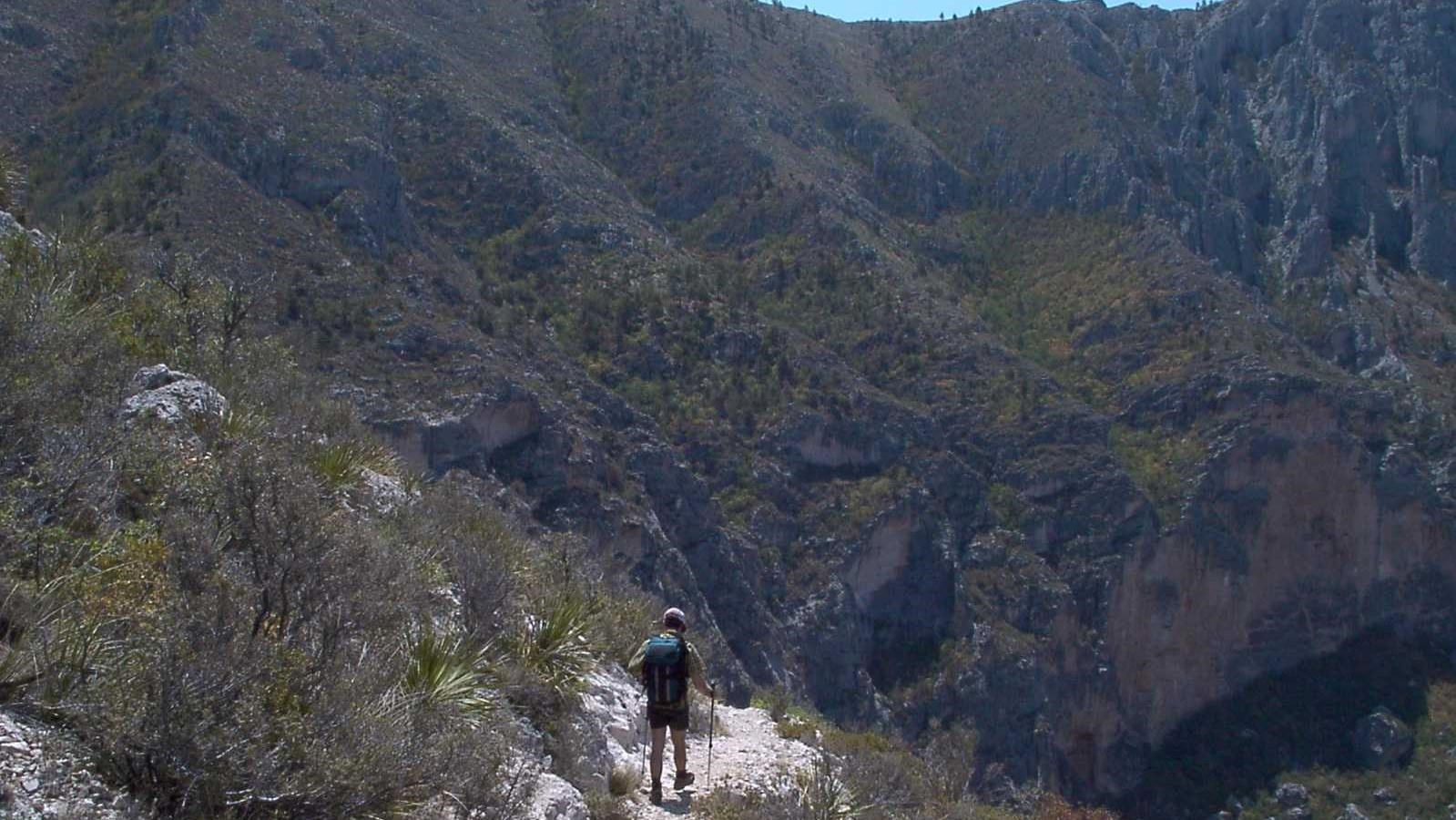 A hiker on a stony trail 