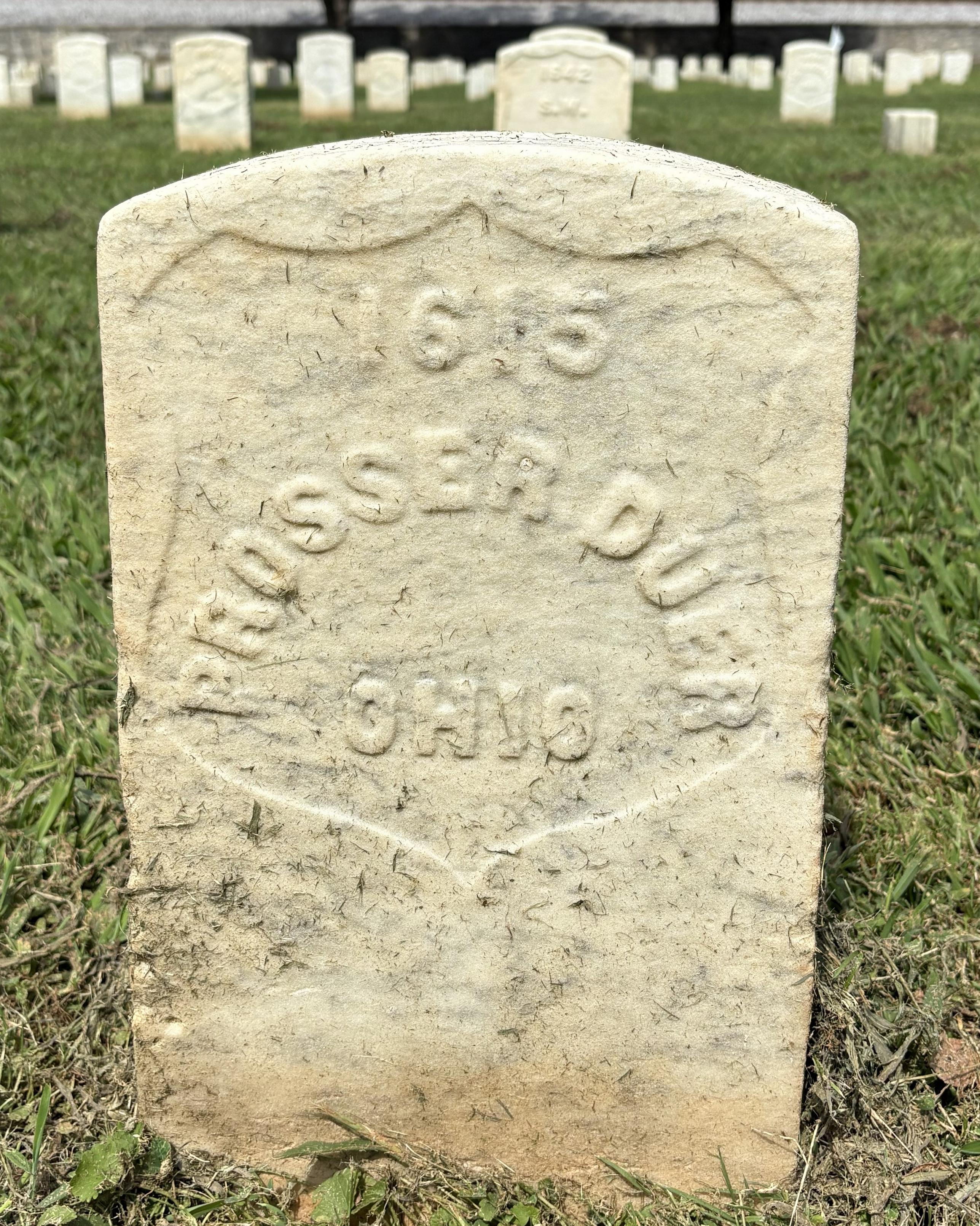 Marble headstone that marks the burial site of Prosser Duer. 