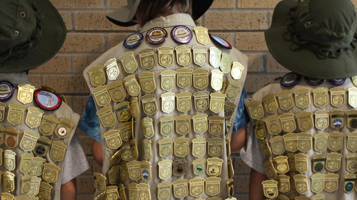 NPS Junior Ranger badges and patches on vests