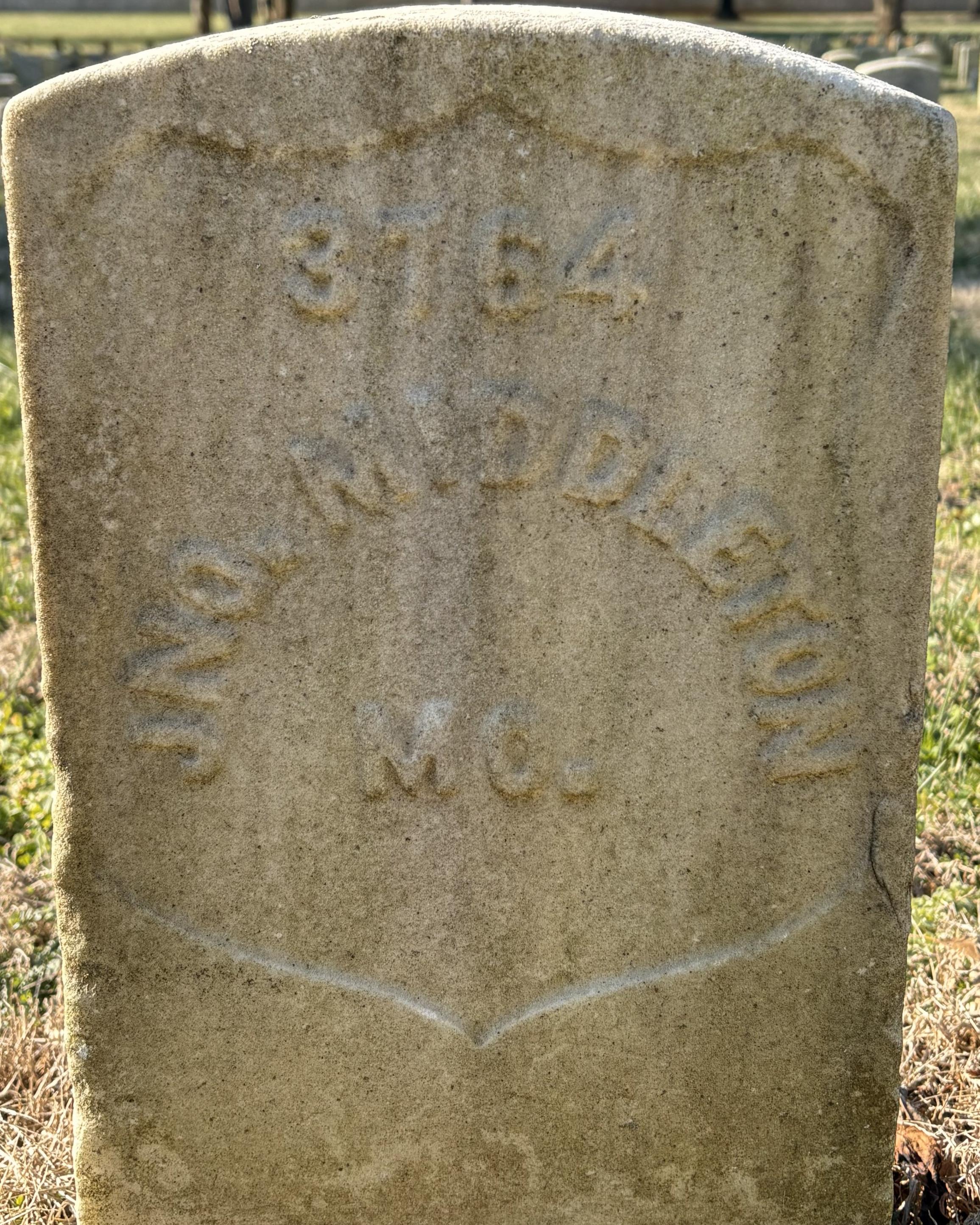 Marble headstone belonging to John Middleton in the Stones River National Cemetery.