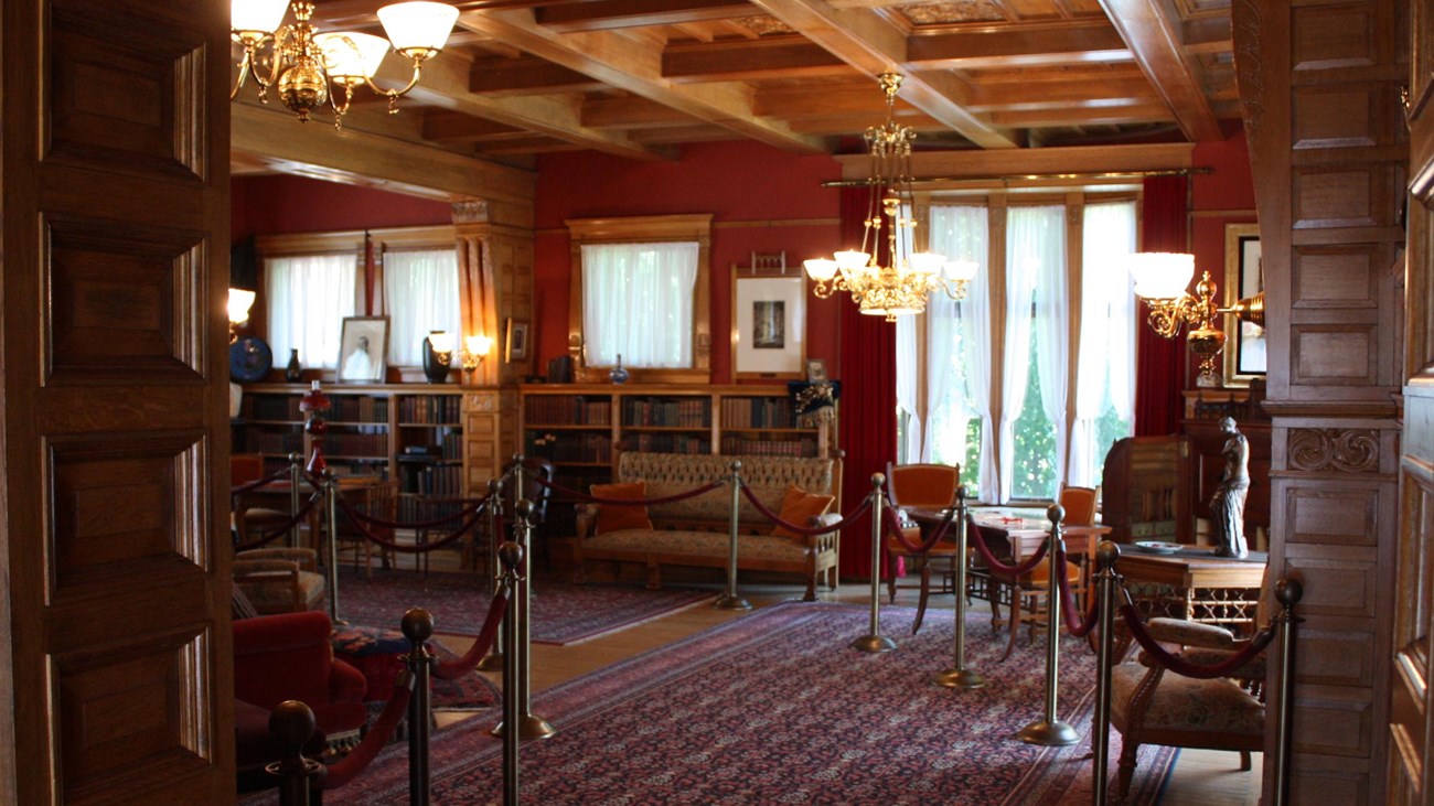 View looking into presidential memorial library showing furniture and window seat.