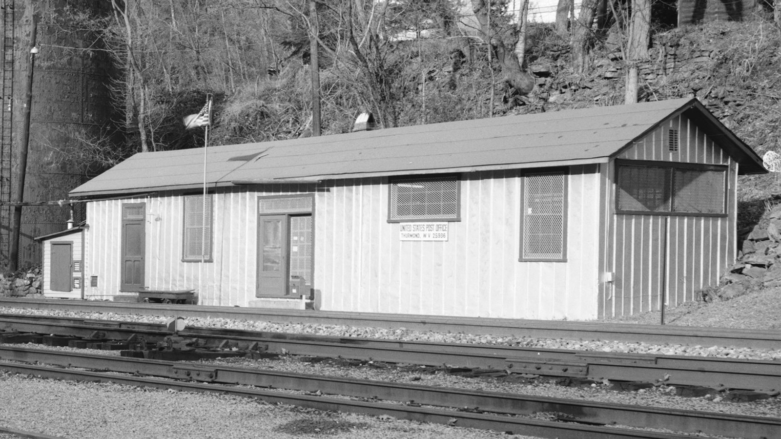A single story building with a sign that says United States Post Office Thurmond