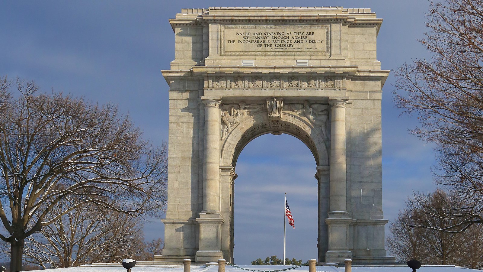 outdoors, snow, trees, arch, monument, flag