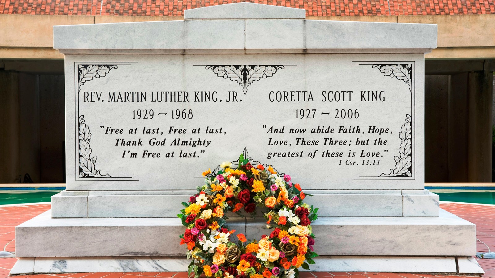 marble tomb containing Dr. and Mrs. King with a floral wreath
