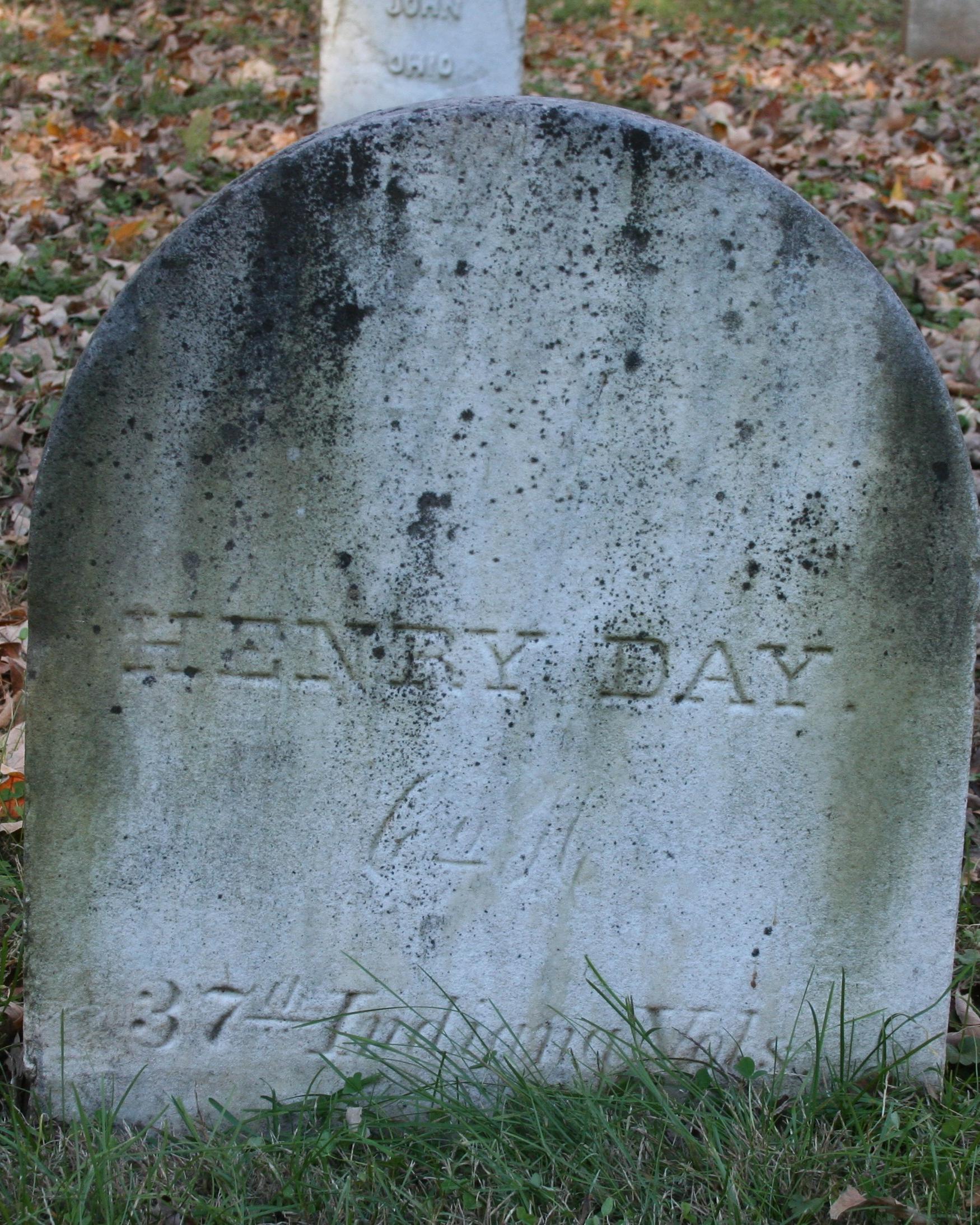 Rounded, short marble headstone. 