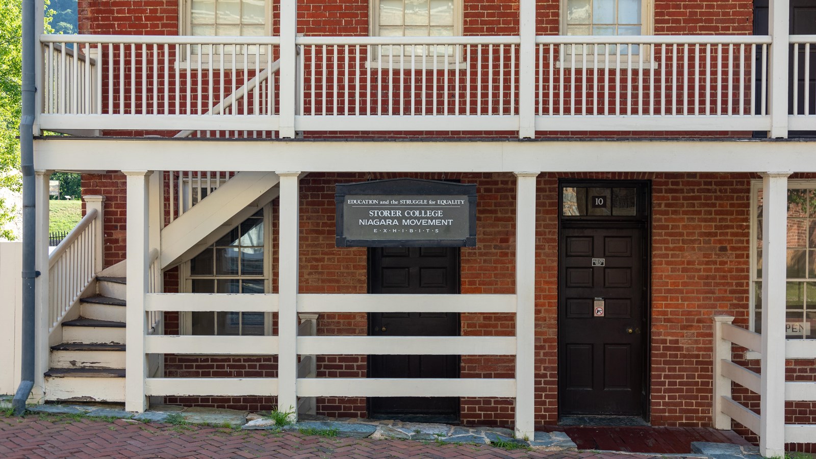 A brick building with a sign