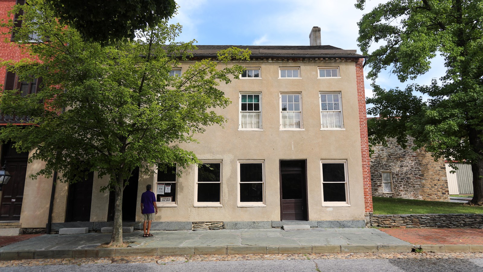 A plain, gray two-story building.