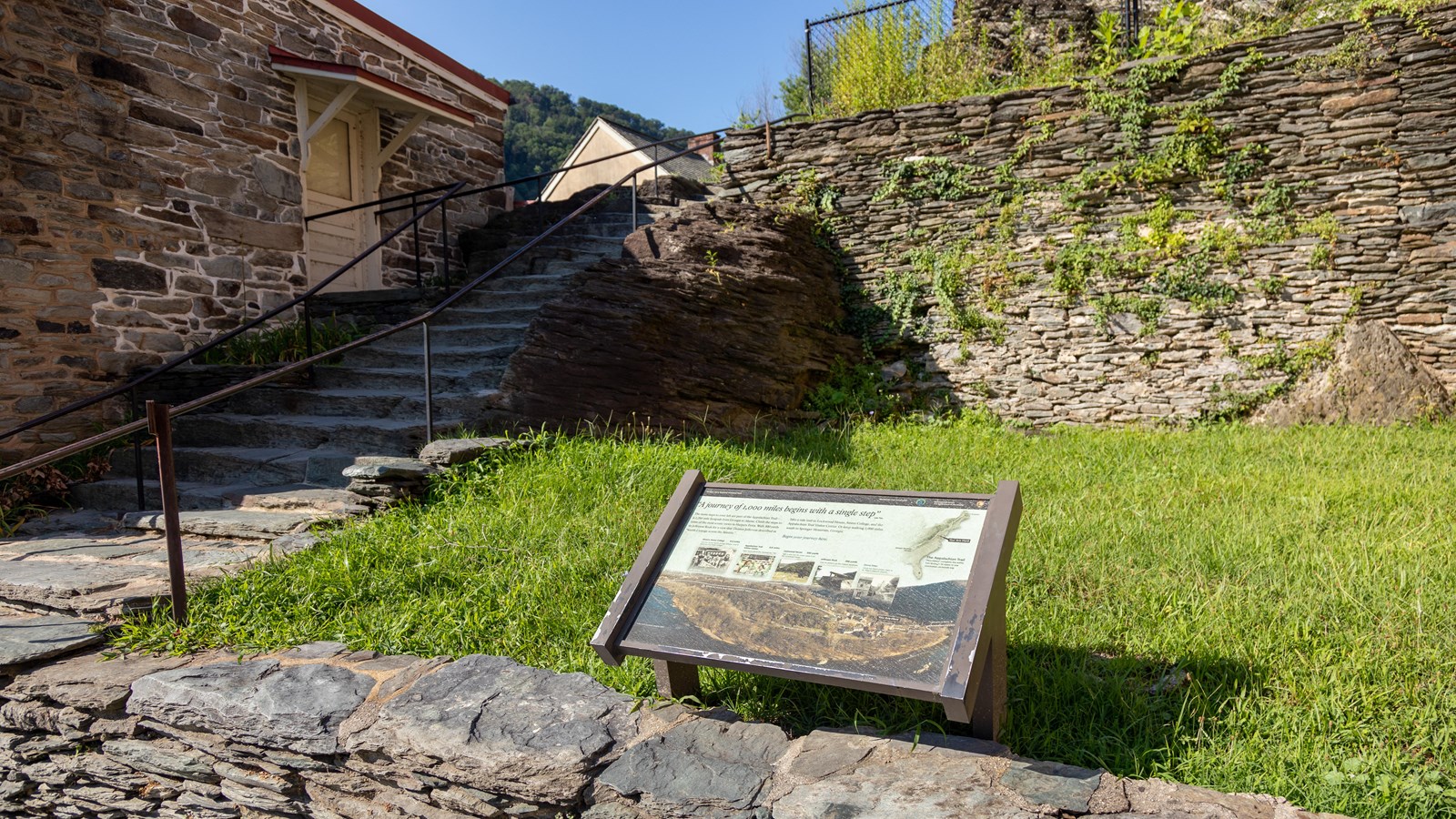 A wayside exhibit in front of a stairway