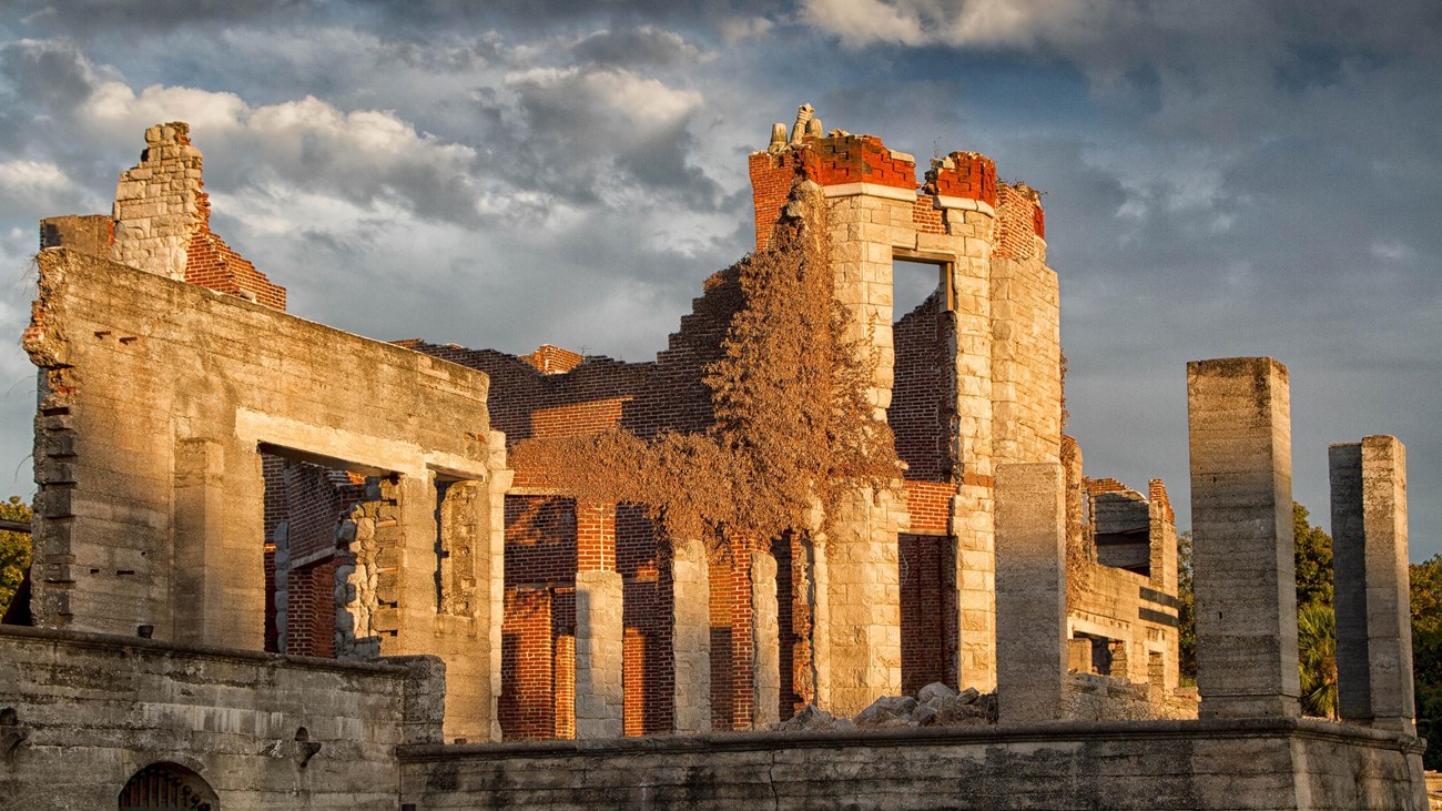 The burnt out ruins of a brick mansion