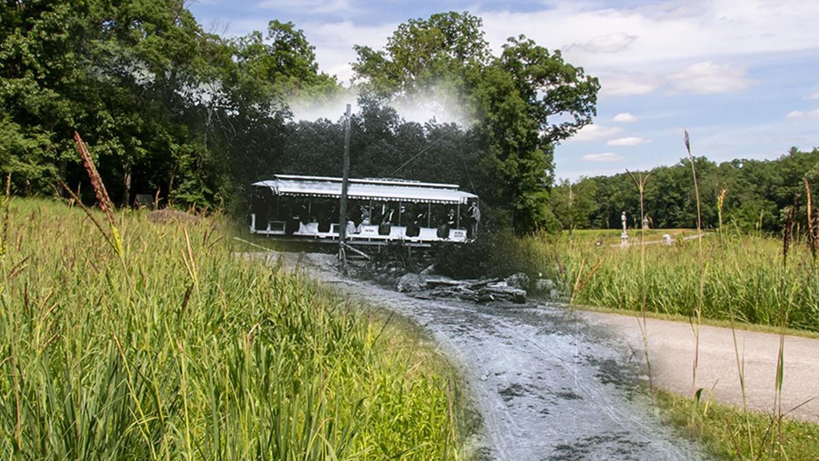 Image of a green field with an overlay of a historic photo with a trolley car on a road.