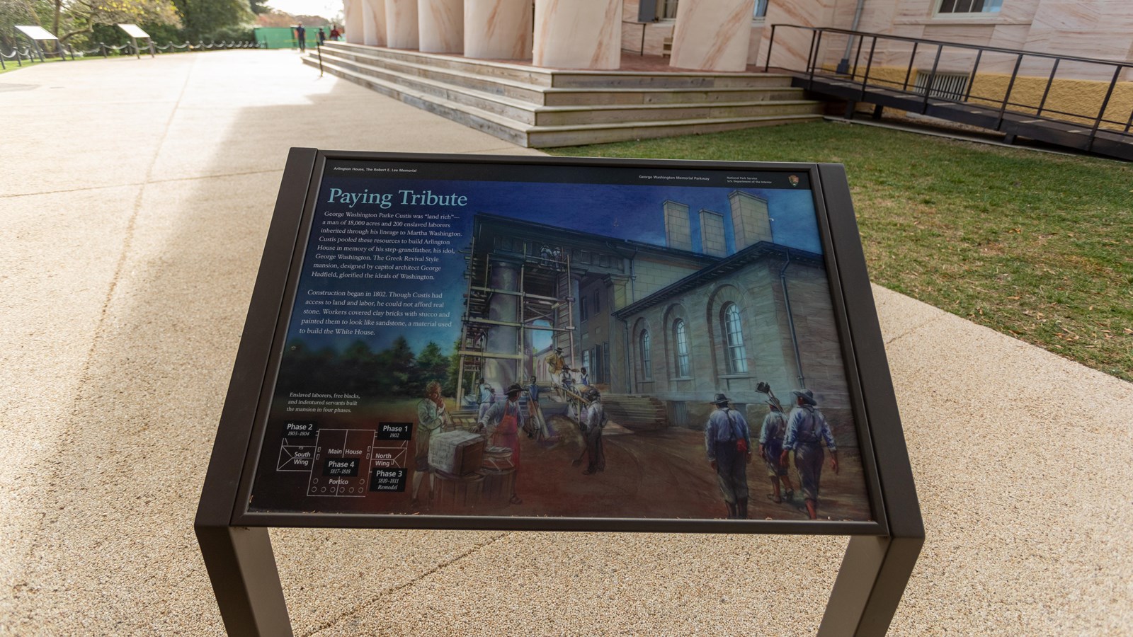 An information panel depicts black construction workers at Arlington House.
