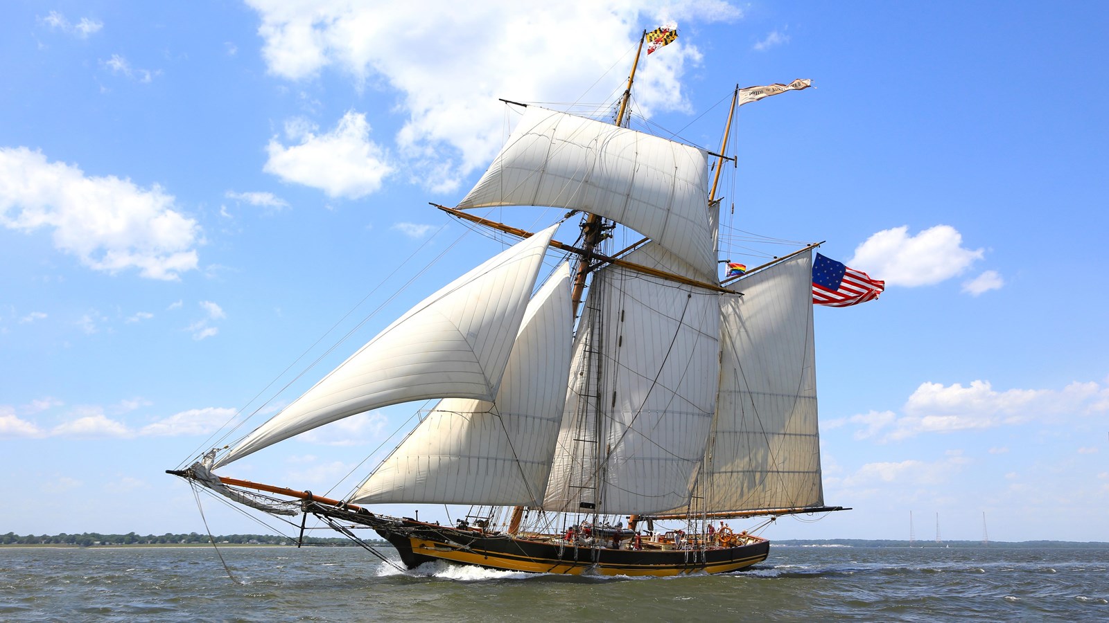 Pride of Baltimore II sailing with fully deployed sails on a clear day.