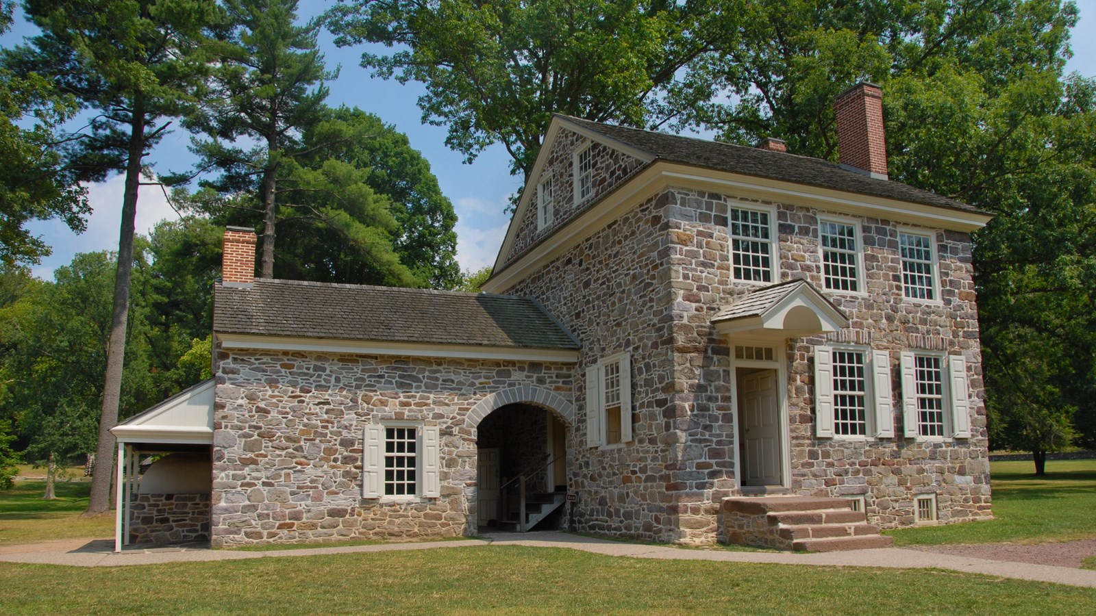 outdoors, stone house, grass, trees