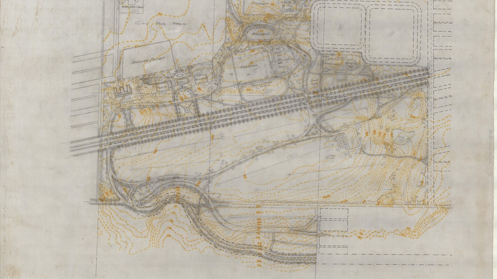 Plan of tree lined road with buildings on one side, open space on other and topographical lines