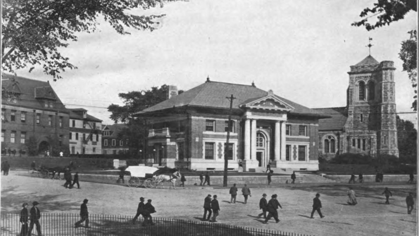 Buildings with people walking in the foreground