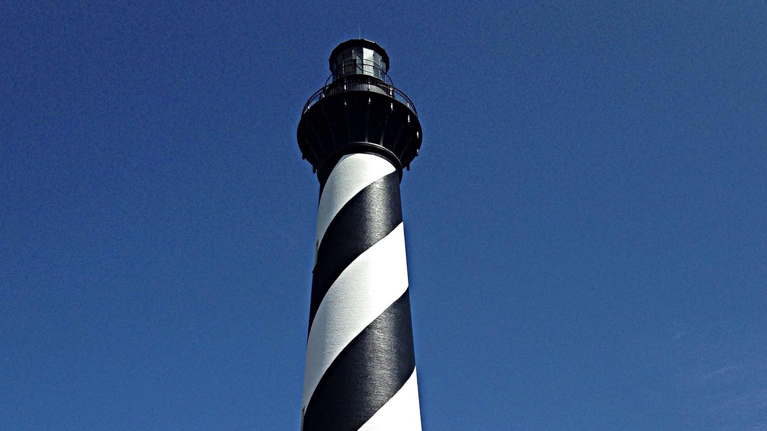 black and white spiral painted lighthouse