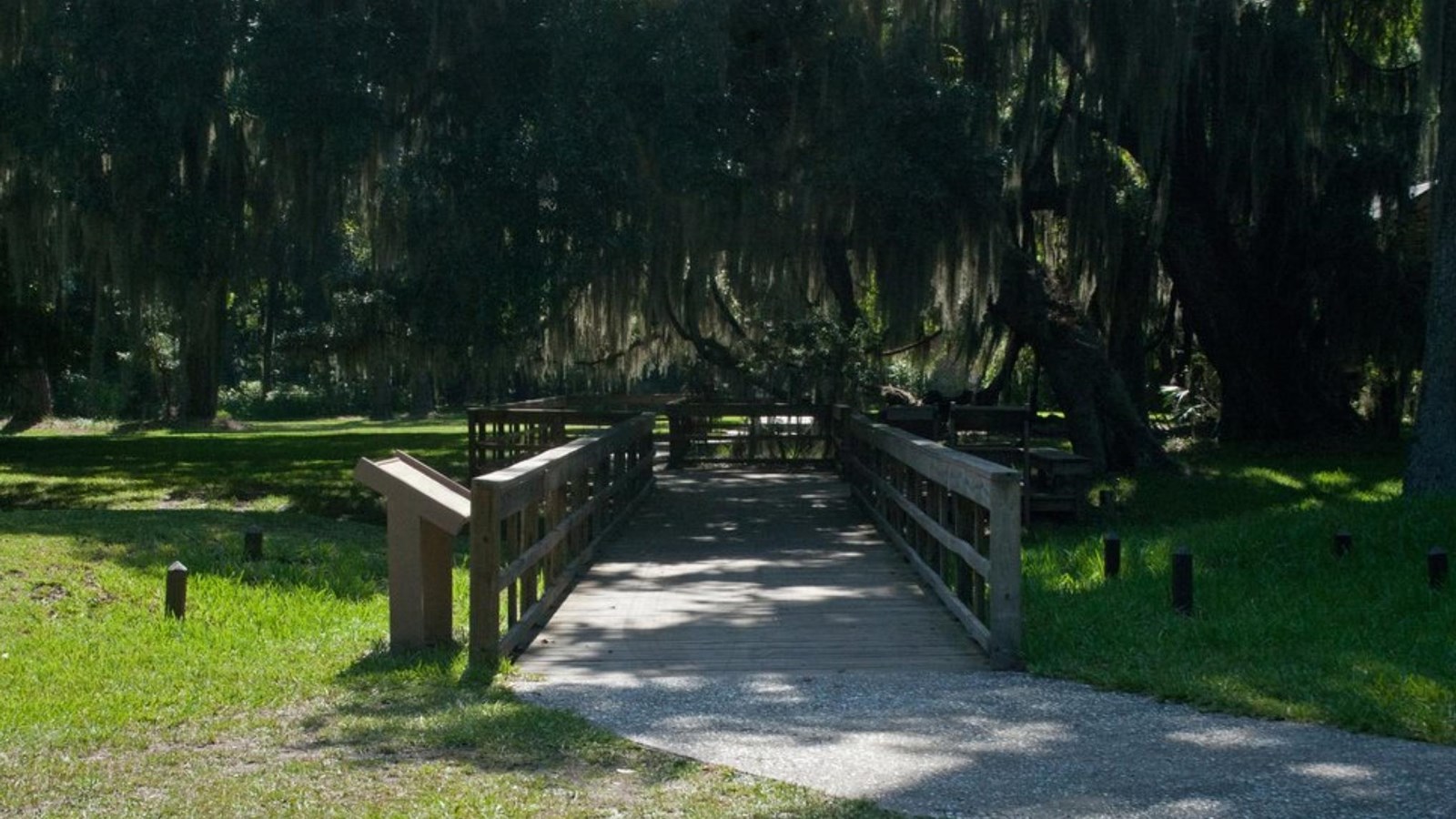 Boardwalk traversing a grassy area where the town fortifications once stood
